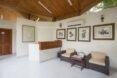 waiting room with soft brown furnishings and tan wall art