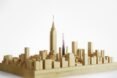 3D model of smaller skyscraper next to Empire State Building