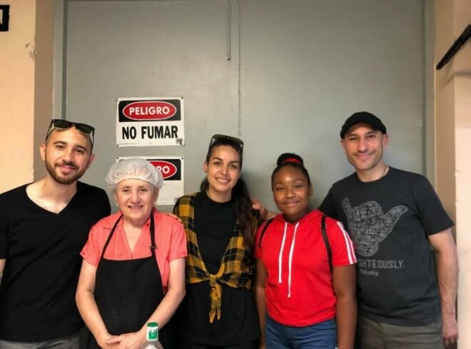 Genesis Butler with team from Chilis on Wheels