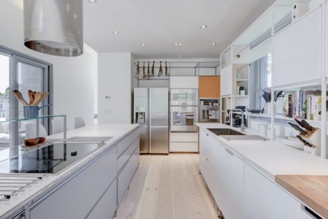 white kitchen with stainless steel appliances