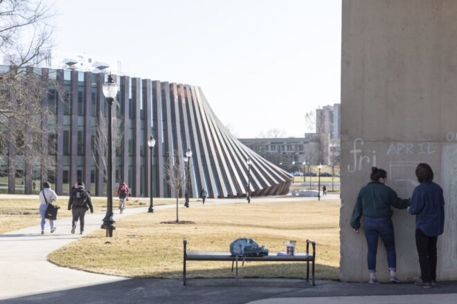 people walking through a courtyard