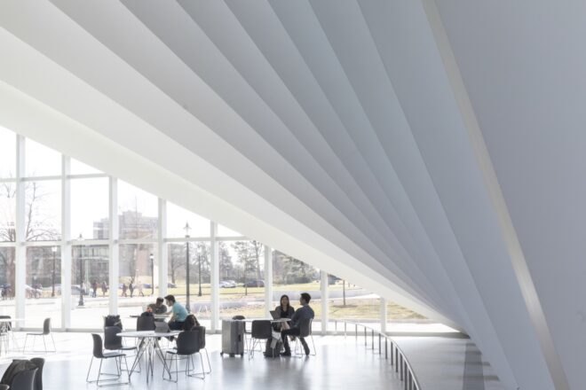white room with slanted, pleated ceiling