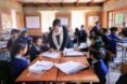 teacher working with students
