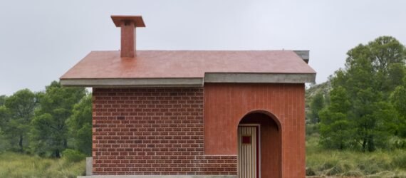 small brick home on grassy lot