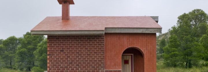 small brick home on grassy lot
