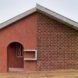 brick home with gabled roof