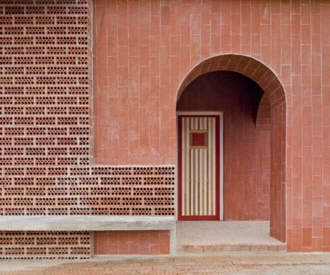rounded doorway to a brick home