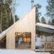 wood micro home with sloped roof in wintery forest