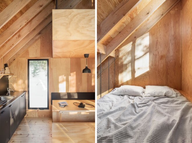 On the left, small kitchenette and dining space. On the right, cozy bed in wood-lined loft area