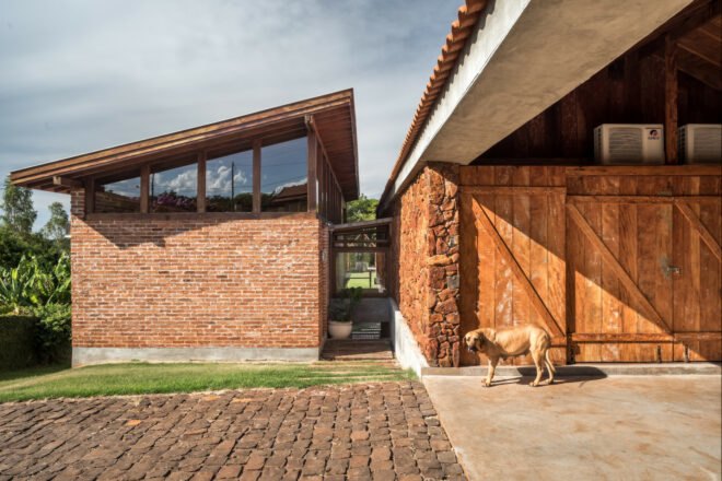 natural stone and brick house with covered patio space