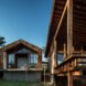 stone home with pitched roof and wooden deck