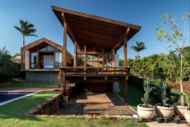 stone and brick house with huge deck