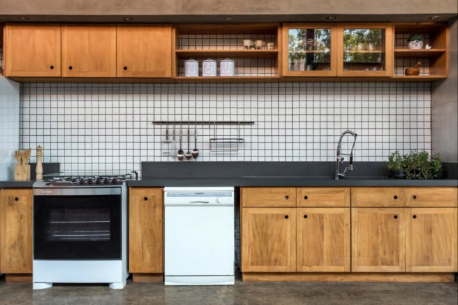 kitchen with wooden cabinets and black and white backsplash
