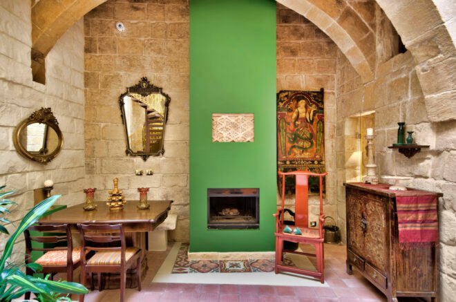 stone room with green fireplace and mantel