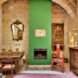 stone room with green fireplace and mantel