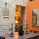 room with stone walls and Buddha art