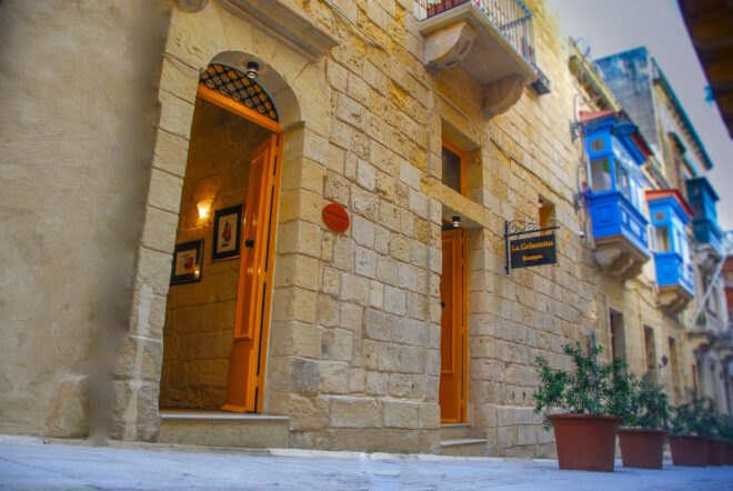 stone wall with various wooden doors