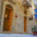 stone wall with various wooden doors