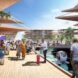 rendering of people walking on wood paths over water