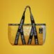 yellow tote bag with black straps