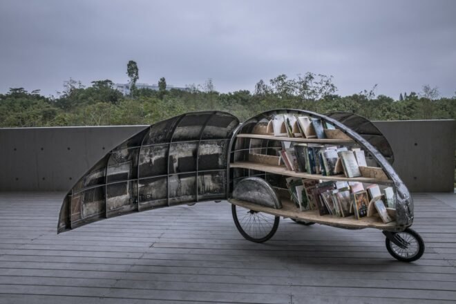 micro library on wheels in the shape of a beetle