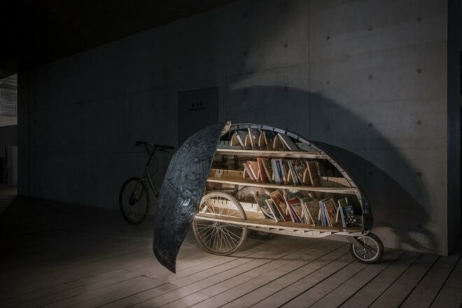 bike with metal covering revealing books inside