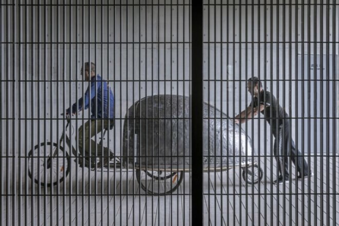 a man riding a beetle-shaped contraption
