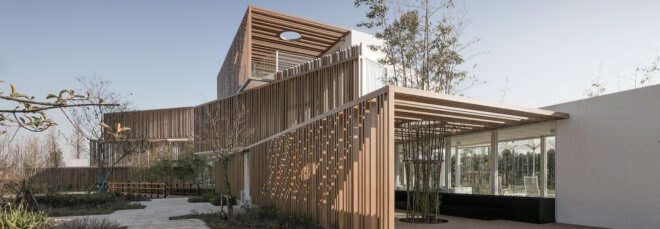 white stacked buildings with wood slatted exteriors