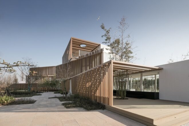 white stacked buildings with wood slatted exteriors