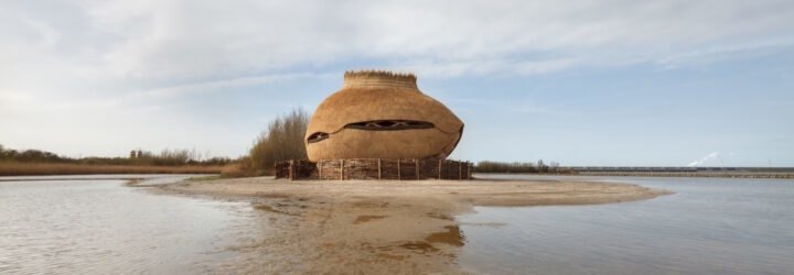 oval wood structure surrounded by water