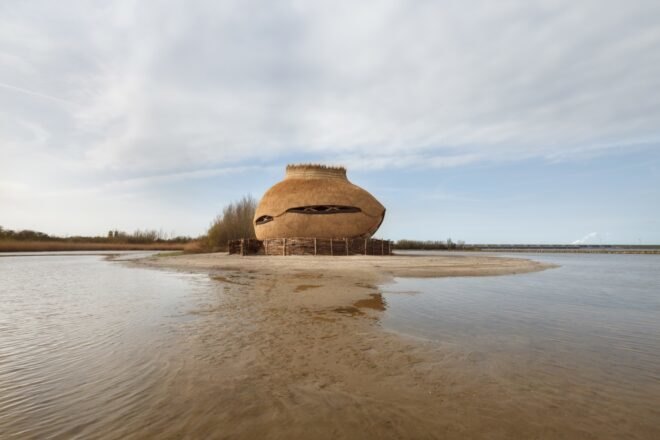oval wood structure surrounded by water