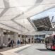 people walking around a solar-powered bus-station