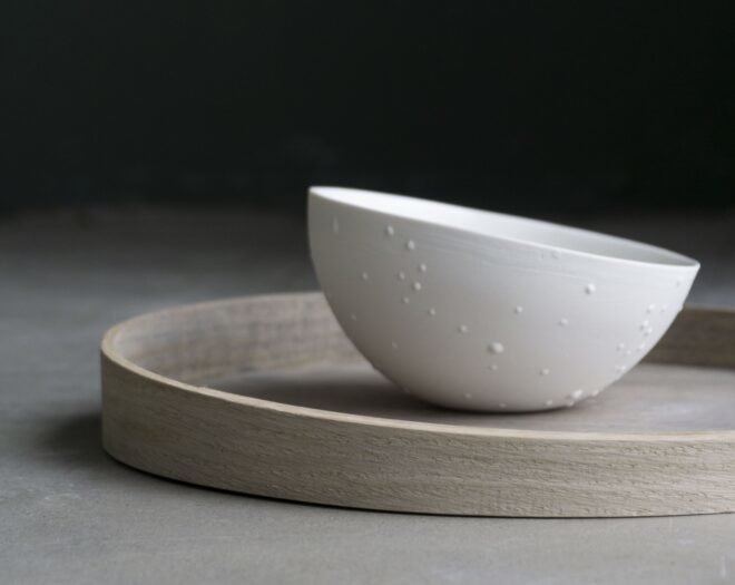 white bowl on a wood plate