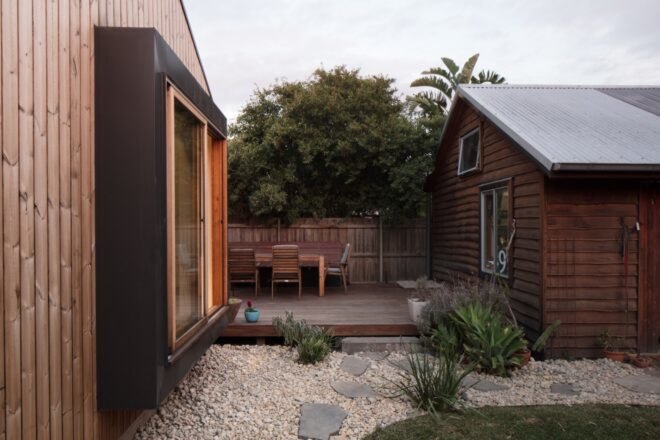 landscaped yard beside a wood deck
