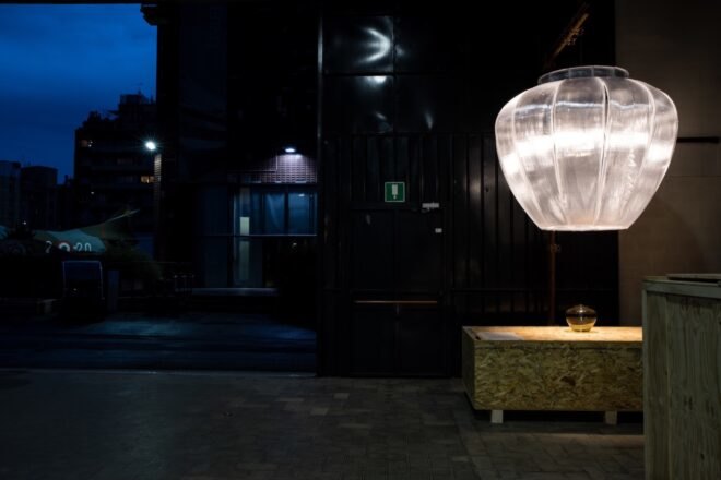 semi-translucent lamp above wood table