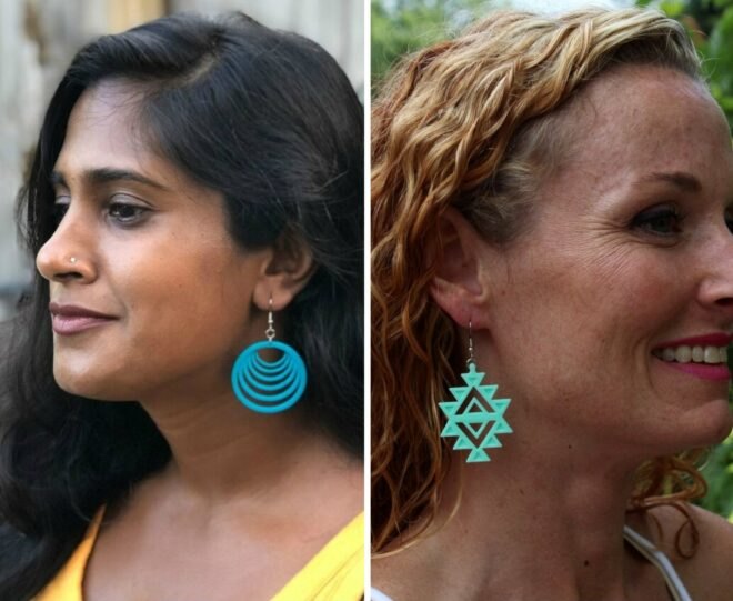 profile of two women with colorful pendant earrings