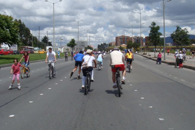 people biking on a highway