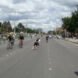 people biking and roller skating on a highway