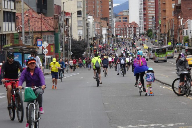 crowds of people biking and walking on empty streets