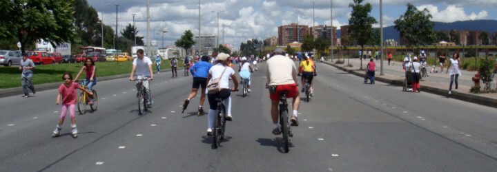 people biking on a highway