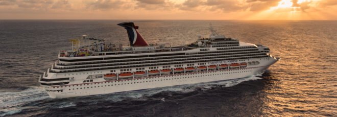 Carnival cruise ship on the ocean at sunset