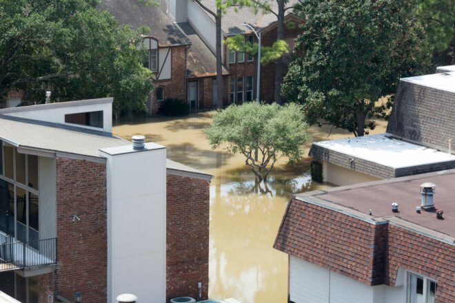 apartment buildings submerged in flood waters
