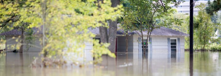 house mostly submerged in flood waters