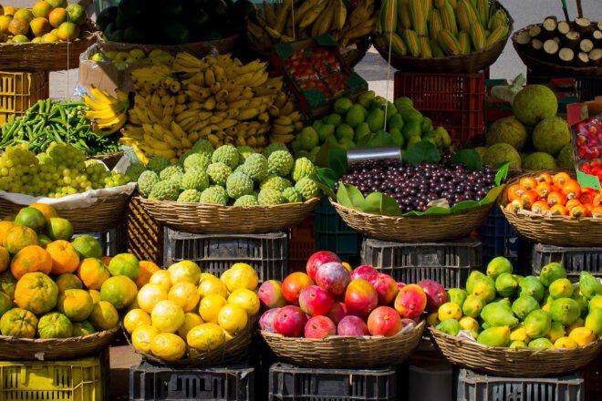 farmers' market with baskets of fresh fruit
