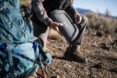 man unzipping a solar cooker