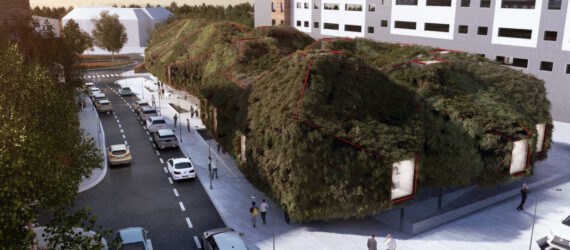 large elongated building covered in lush greenery