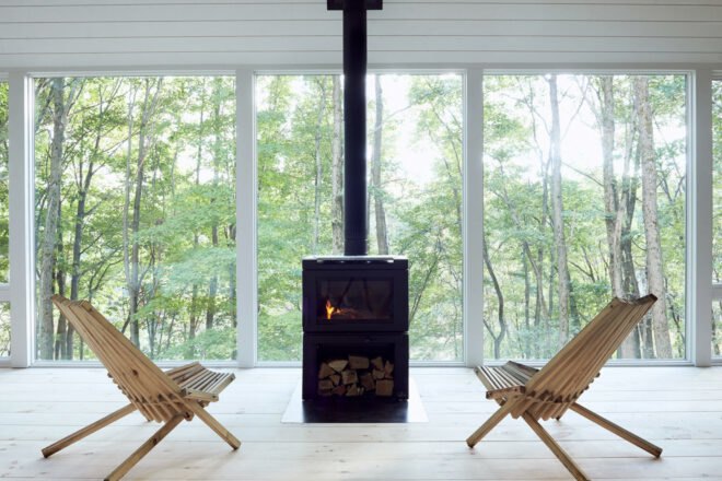two chairs facing a wood-burning stove