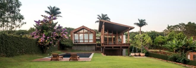 home with pitched roof and wooden deck