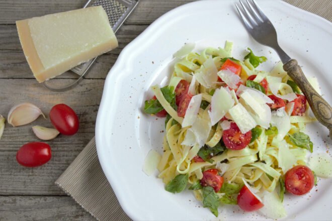 pasta with cheese and tomatoes on a plate