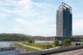 tall wood building overlooking hills and lake